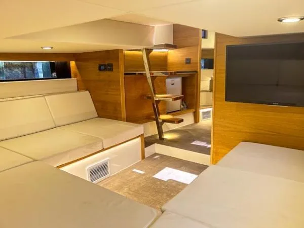  Yacht Photos Pics Luxurious interior of 2022 De Antonio Yachts D42, featuring modern seating and wooden accents.