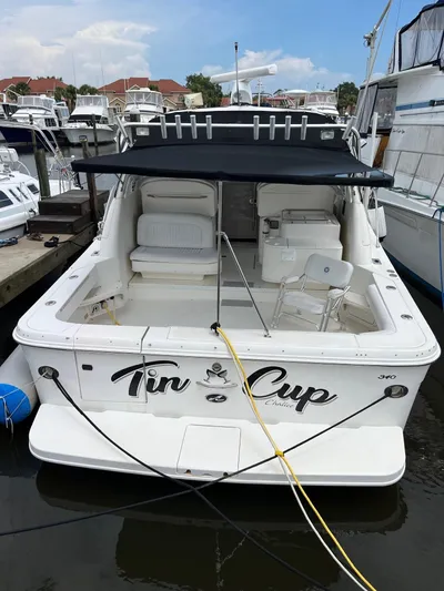Tin Cup Yacht Photos Pics 2001 Sea Ray 340 Amberjack boat docked, featuring spacious seating and canopy.