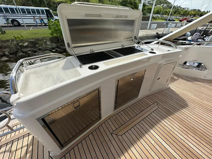  Yacht Photos Pics Outdoor kitchen on 2018 Riviera 60SY yacht with grill and storage.