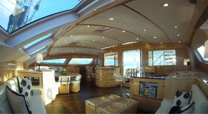 Cattitude Yacht Photos Pics Luxurious interior of 2013 Privilege 745 yacht with elegant furnishings and panoramic windows.