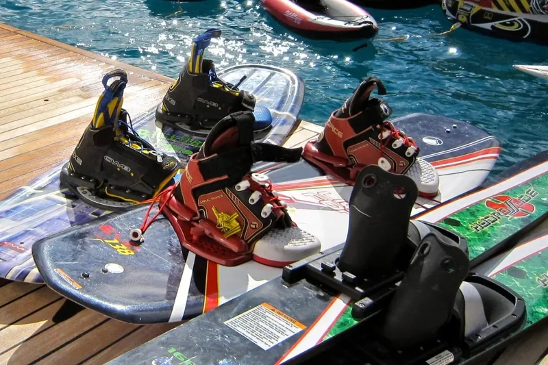 Cattitude Yacht Photos Pics Wakeboards with bindings on a Privilege 745 yacht deck, 2013 model, near water.