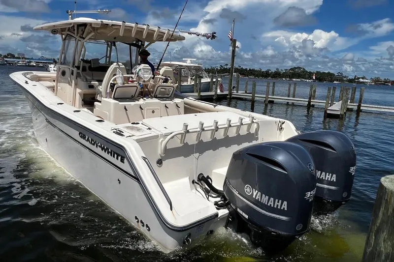  Yacht Photos Pics 2015 Grady-White Canyon 336 boat with twin Yamaha engines docked on a sunny day.