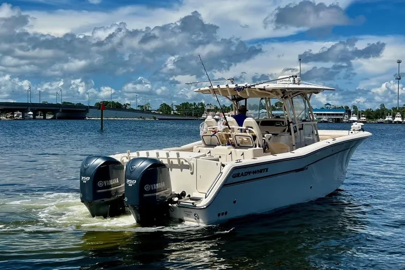  Yacht Photos Pics 2015 Grady-White Canyon 336 boat with twin Yamaha engines on a sunny day.