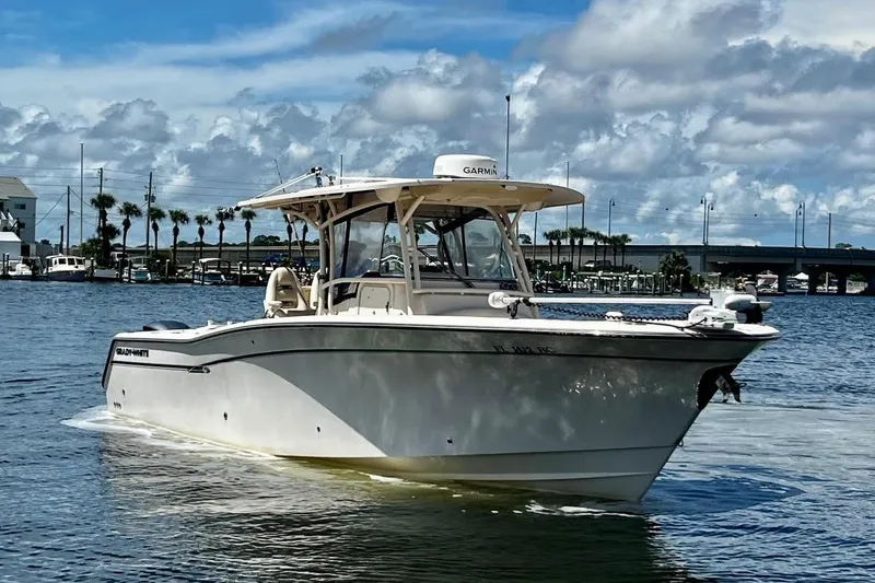  Yacht Photos Pics 2015 Grady-White Canyon 336 boat on water under cloudy sky.