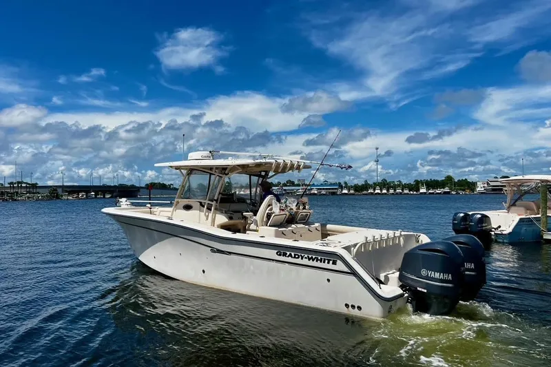  Yacht Photos Pics 2015 Grady-White Canyon 336 boat cruising on a sunny day with Yamaha engines.