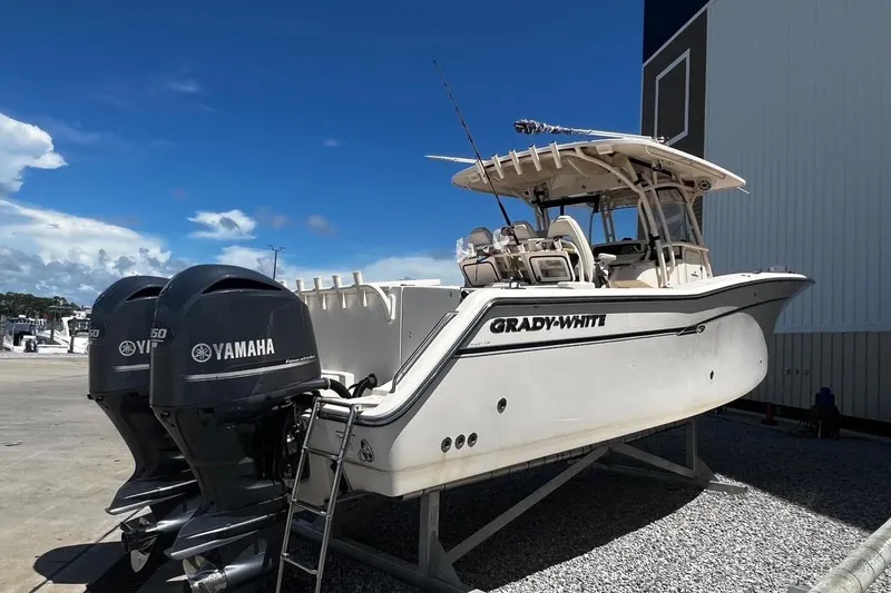  Yacht Photos Pics 2015 Grady-White Canyon 336 boat with twin Yamaha engines on a sunny day.