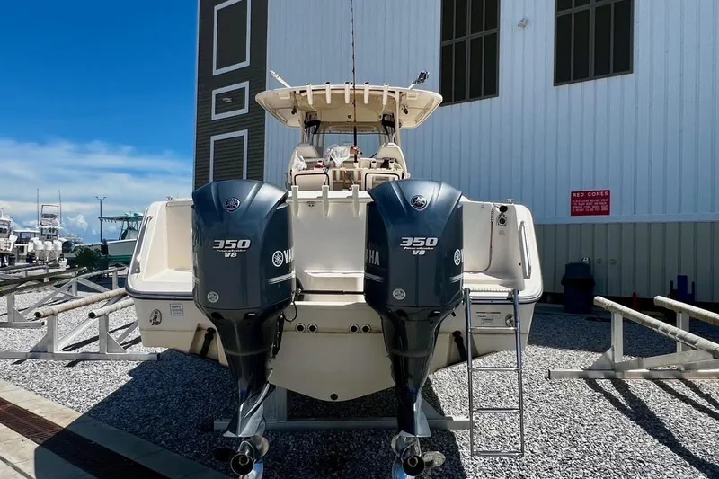  Yacht Photos Pics 2015 Grady-White Canyon 336 boat with twin Yamaha 350 V8 engines, docked outdoors.