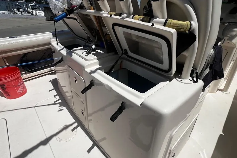  Yacht Photos Pics 2015 Grady-White Canyon 336 boat deck with open storage compartments.