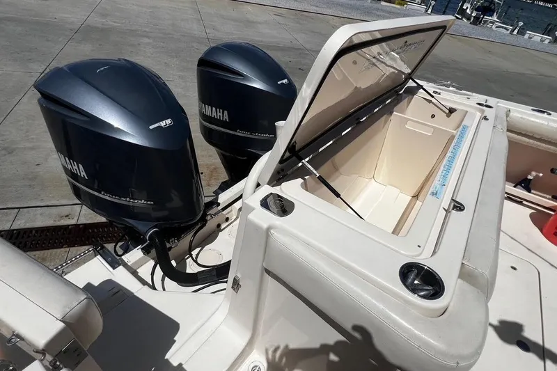  Yacht Photos Pics 2015 Grady-White Canyon 336 boat with Yamaha outboard engines and open storage compartment.