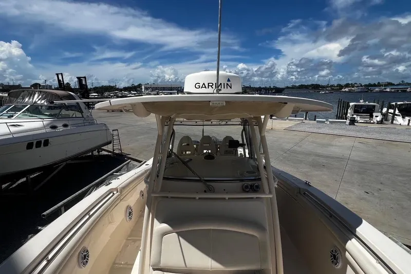  Yacht Photos Pics 2015 Grady-White Canyon 336 boat docked with Garmin equipment, under a clear blue sky.