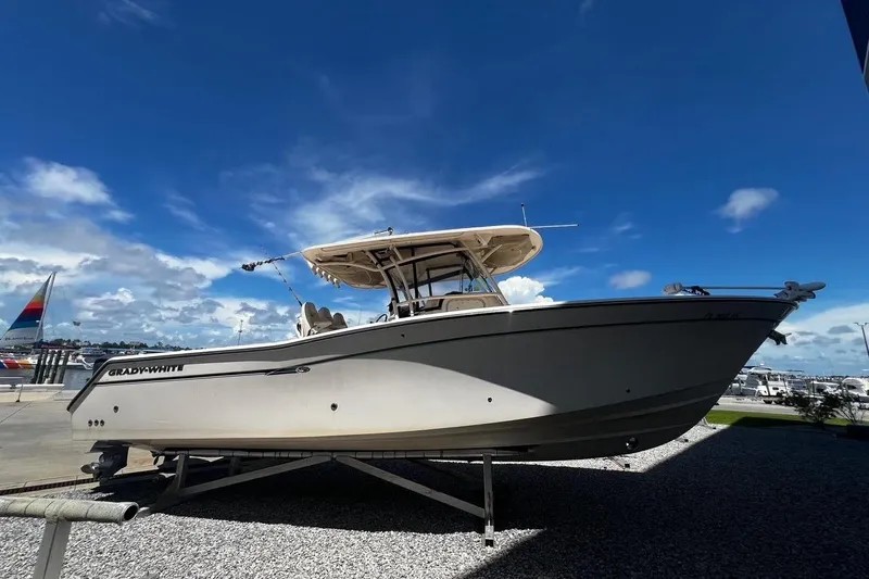  Yacht Photos Pics 2015 Grady-White Canyon 336 boat displayed outdoors under a clear blue sky.