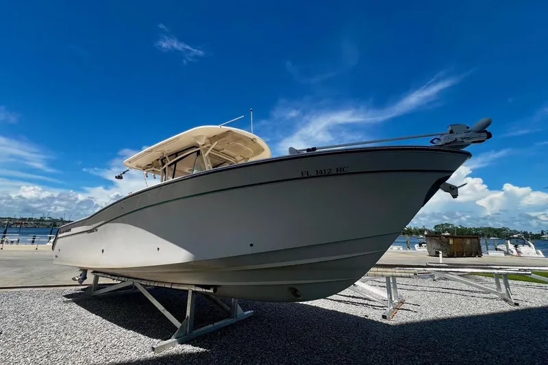  Yacht Photos Pics 2015 Grady-White Canyon 336 boat on display under clear blue sky.