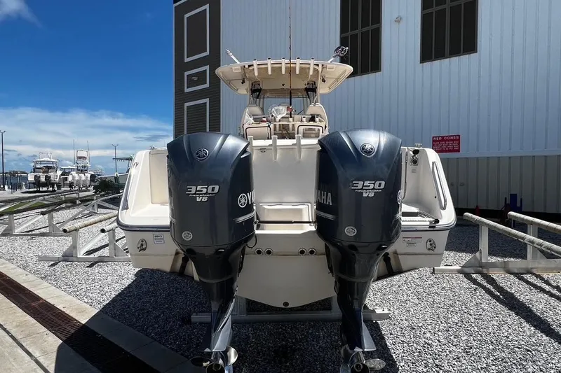  Yacht Photos Pics 2015 Grady-White Canyon 336 boat with twin Yamaha 350 V8 engines, docked outdoors.
