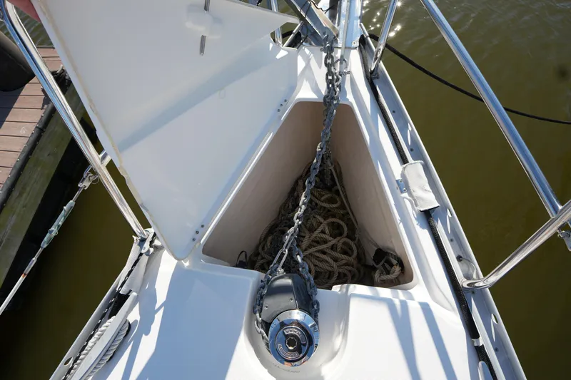 Andiamo! Yacht Photos Pics Bow of 2007 Beneteau 373 sailboat with anchor chain and rope storage.