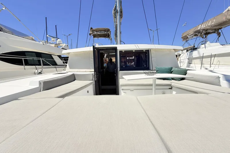 High School Yacht Photos Pics Luxurious 2023 Bali 4.2 yacht with spacious deck and seating area in marina.