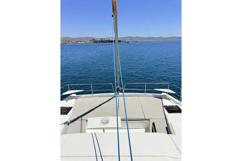 High School Yacht Photos Pics 2023 Bali 4.2 yacht deck overlooking calm blue sea and distant shoreline.