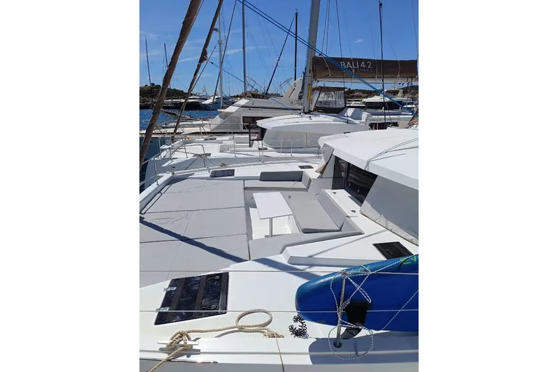High School Yacht Photos Pics 2023 Bali 4.2 catamaran with spacious deck and modern design, docked at marina.