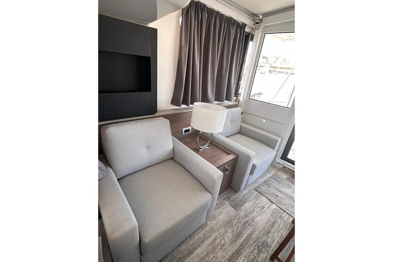 High School Yacht Photos Pics Modern interior of 2023 Bali 4.2 yacht with cozy seating and elegant decor.