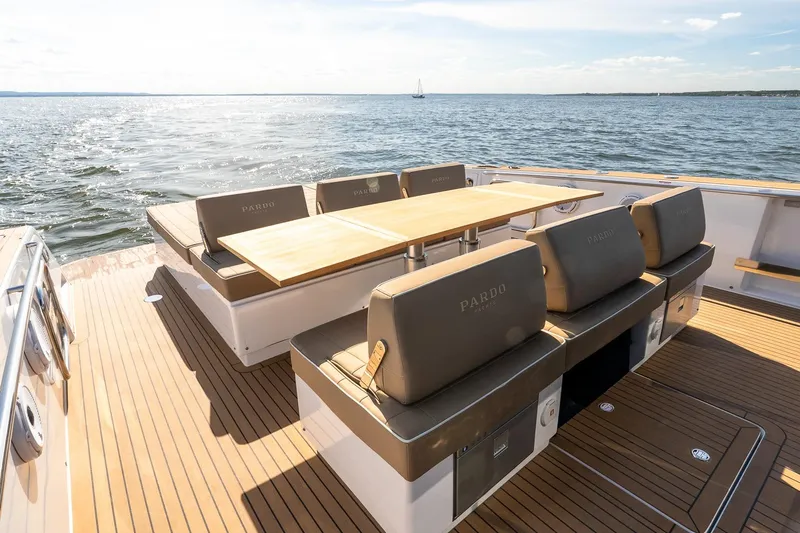  Yacht Photos Pics 2023 Pardo Yachts 43 deck with seating and table, overlooking the ocean.