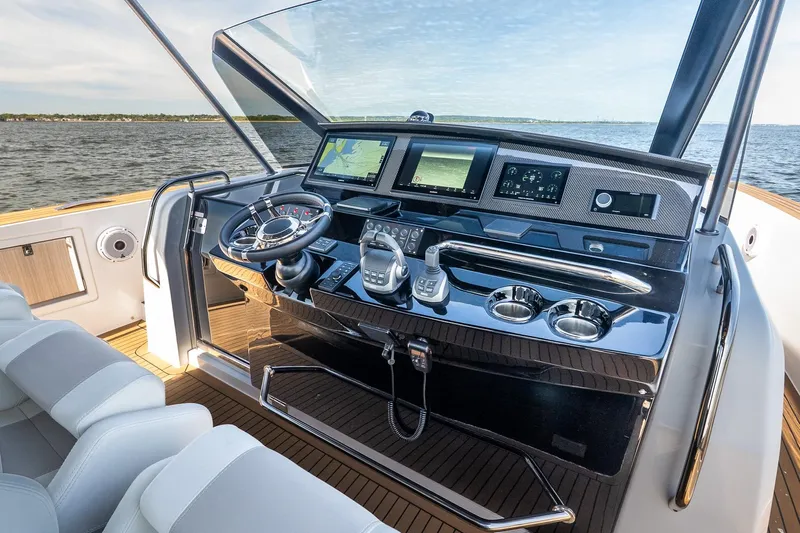  Yacht Photos Pics 2023 Pardo Yachts 43 helm with modern navigation systems and luxurious seating.