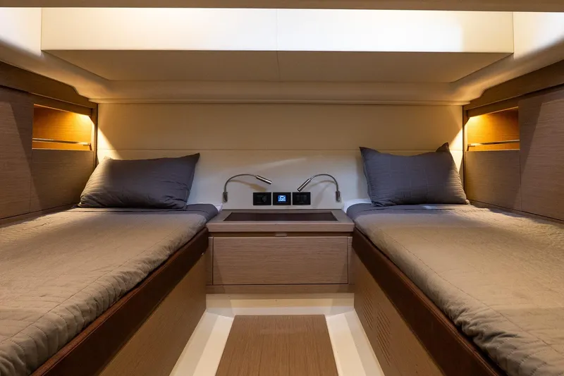  Yacht Photos Pics Luxurious cabin interior of 2023 Pardo Yachts 43 with twin beds and ambient lighting.