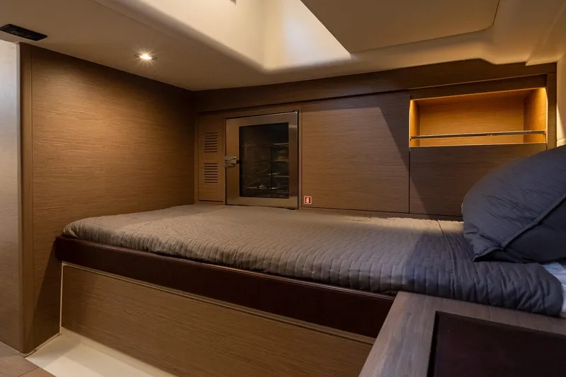  Yacht Photos Pics Luxurious cabin interior of 2023 Pardo Yachts 43, featuring a cozy bed and modern design.