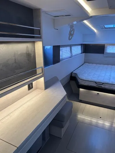 About Time Yacht Photos Pics Modern interior of 2021 Leopard 45 yacht with sleek design and comfortable sleeping area.
