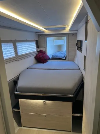 About Time Yacht Photos Pics Interior of 2021 Leopard 45 yacht cabin with modern bed and ambient lighting.