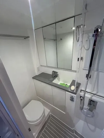 About Time Yacht Photos Pics Modern bathroom in 2021 Leopard 45 yacht with shower, toilet, and mirrored cabinet.