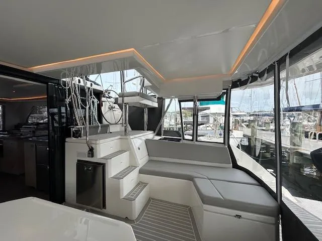 About Time Yacht Photos Pics Modern interior of 2021 Leopard 45 catamaran with sleek seating and ambient lighting.