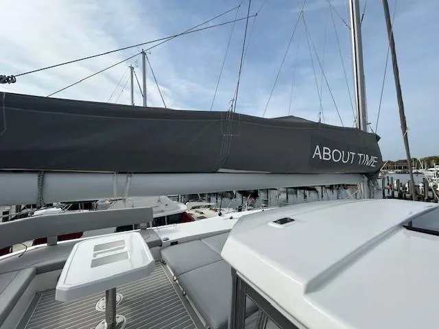 About Time Yacht Photos Pics 2021 Leopard 45 catamaran with "About Time" sail cover at marina.
