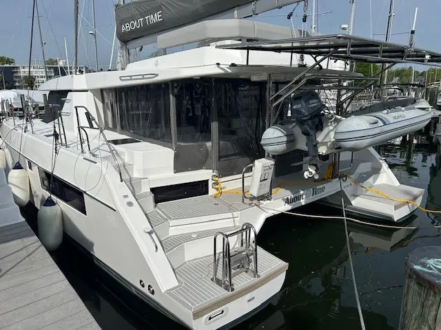 About Time Yacht Photos Pics 2021 Leopard 45 catamaran docked, featuring sleek design and modern amenities.