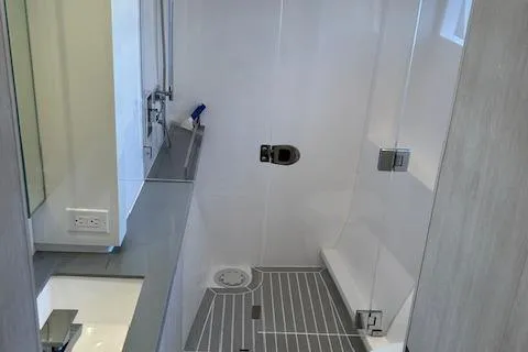 About Time Yacht Photos Pics Modern bathroom in 2021 Leopard 45 yacht with sleek shower and vanity.