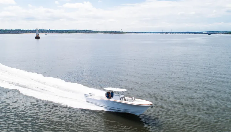  Yacht Photos Pics 2025 Buddy Davis 34 Center Console boat cruising on open water.