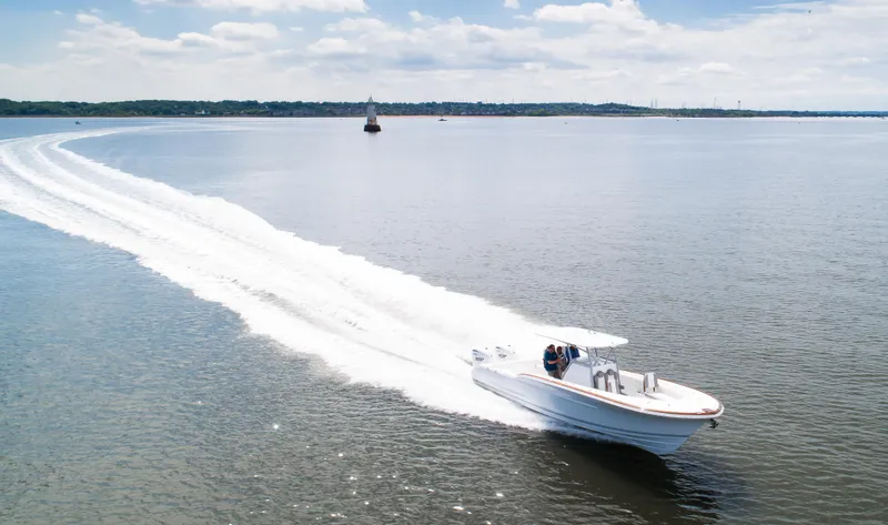  Yacht Photos Pics 2025 Buddy Davis 34 Center Console boat cruising on open water.