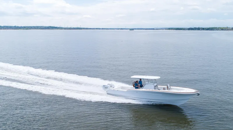  Yacht Photos Pics 2025 Buddy Davis 34 Center Console boat cruising on open water.