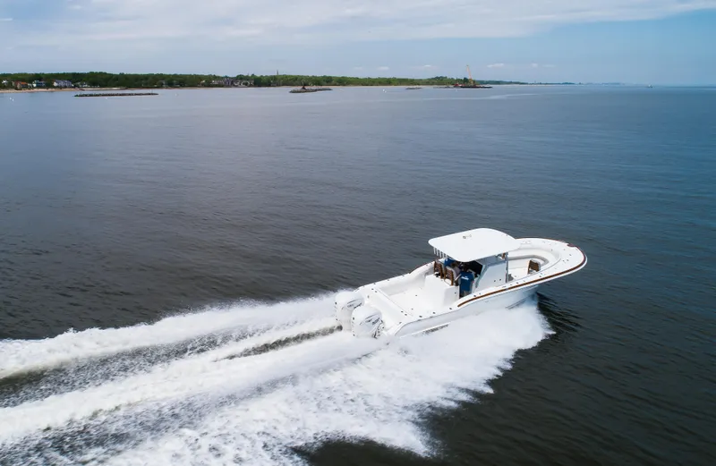  Yacht Photos Pics 2025 Buddy Davis 34 Center Console boat cruising on open water.