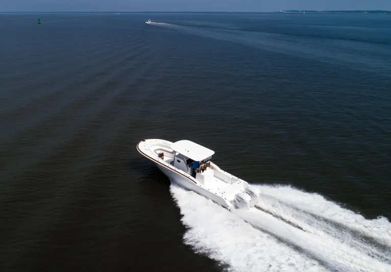  Yacht Photos Pics 2025 Buddy Davis 34 Center Console boat cruising on open water.