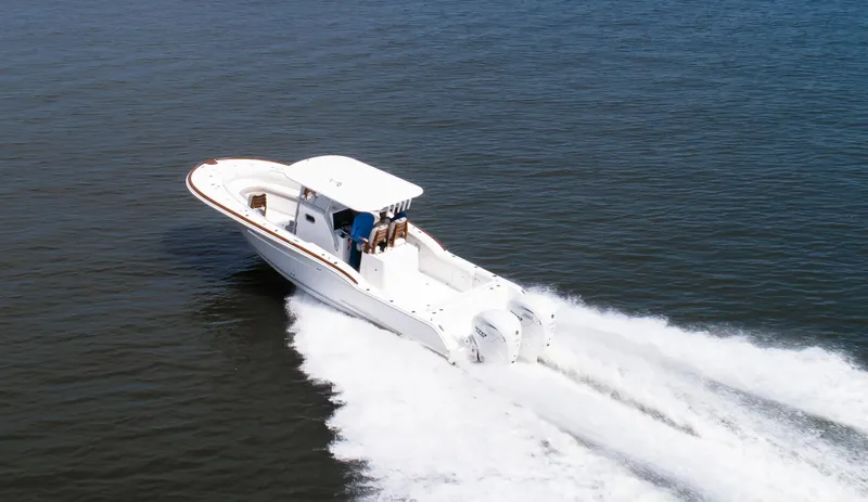  Yacht Photos Pics 2025 Buddy Davis 34 Center Console boat cruising on open water.