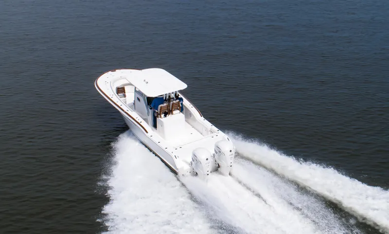  Yacht Photos Pics 2025 Buddy Davis 34 Center Console boat cruising on open water.