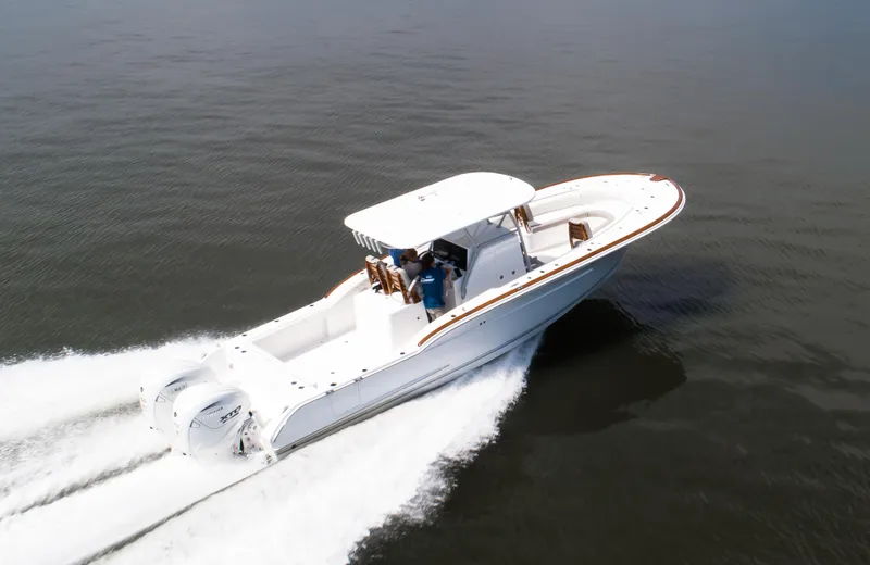  Yacht Photos Pics 2025 Buddy Davis 34 Center Console boat cruising on open water.