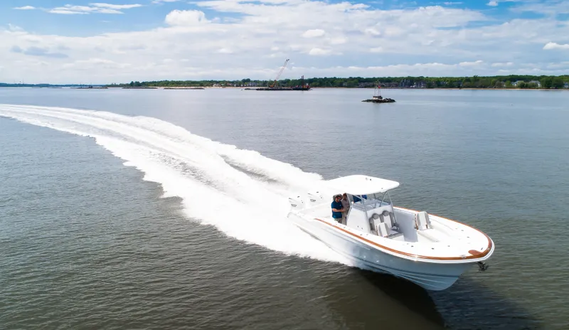  Yacht Photos Pics 2025 Buddy Davis 34 Center Console boat cruising on open water.