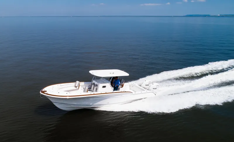  Yacht Photos Pics 2025 Buddy Davis 34 Center Console boat cruising on open water.