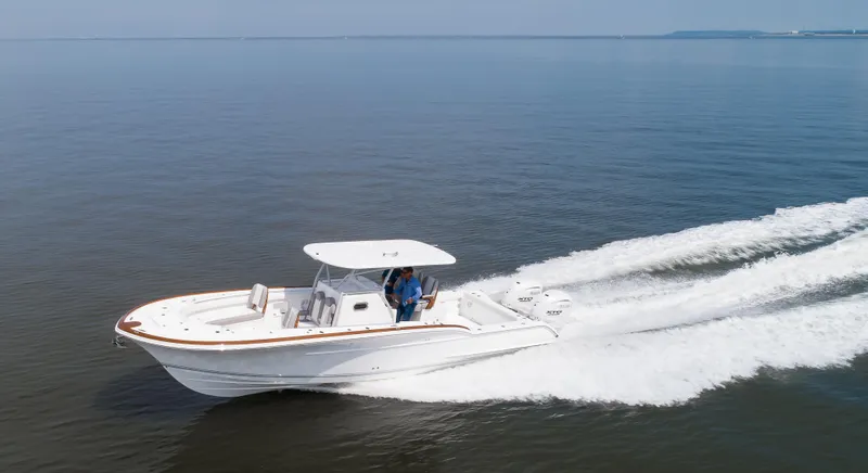  Yacht Photos Pics 2025 Buddy Davis 34 Center Console boat cruising on open water.