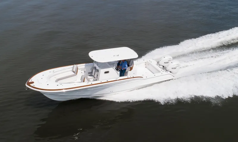  Yacht Photos Pics 2025 Buddy Davis 34 Center Console boat cruising on open water.