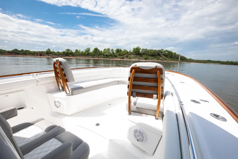  Yacht Photos Pics 2025 Buddy Davis 34 Center Console boat interior on a calm lake.