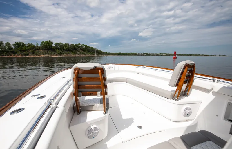  Yacht Photos Pics 2025 Buddy Davis 34 Center Console boat on calm water, featuring spacious seating.