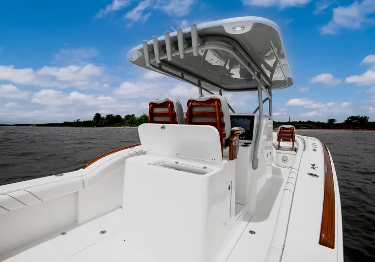  Yacht Photos Pics 2025 Buddy Davis 34 Center Console boat on open water, featuring sleek design and modern amenities.