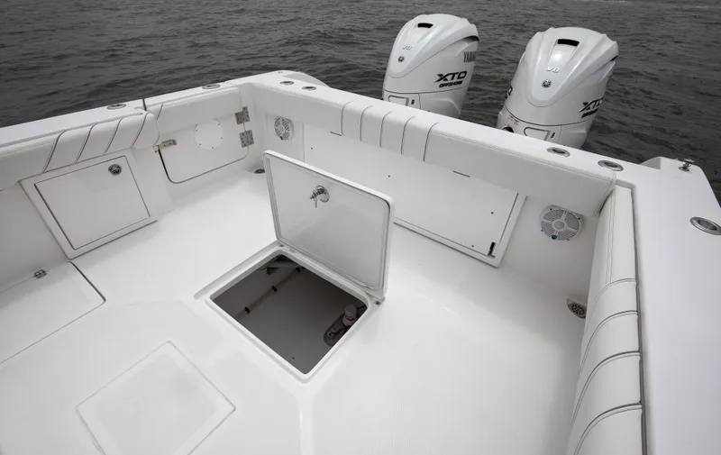  Yacht Photos Pics 2025 Buddy Davis 34 Center Console boat deck with open hatch and twin engines.
