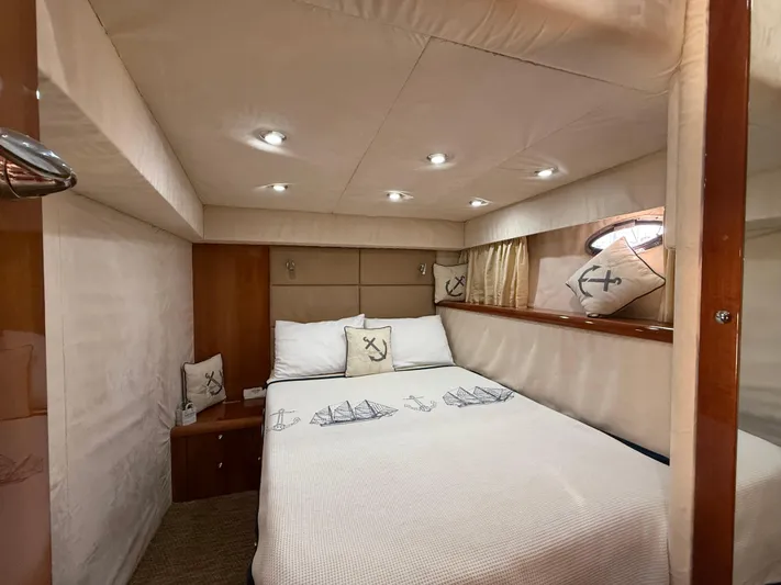  Yacht Photos Pics Luxurious cabin interior of 2006 Sunseeker Portofino 53 yacht with elegant bedding.